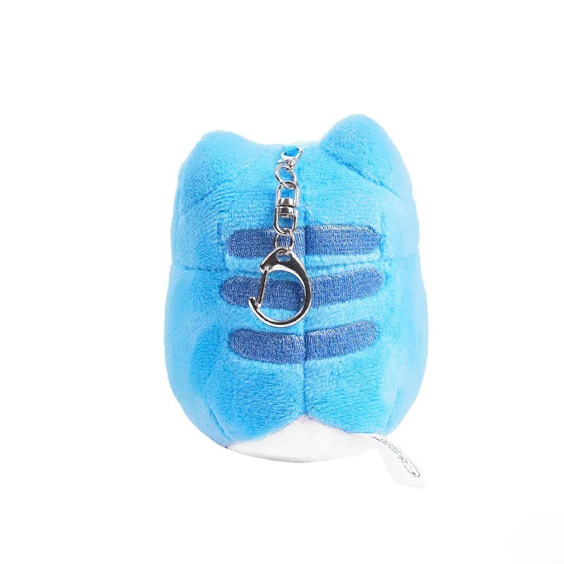 Back view of Gamer Capoo Plush Charm displaying blue stripes and tag