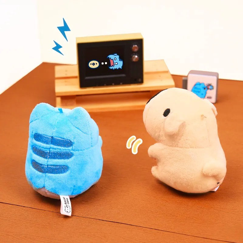 Capoo and Dogdog plush charms sitting in front of a TV, playing a retro video game together