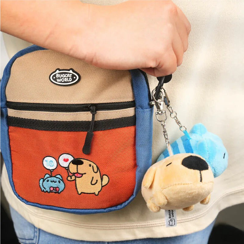 Dogdog Lazy Plush Charm and Capoo Lazy Plush Charm attached to a colorful mini backpack, displayed while being carried.