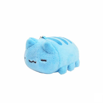 Side view of the Lazy Capoo plush charm showing Capoo lying down with closed eyes and a relaxed expression, blue stripes on the back and a soft texture.