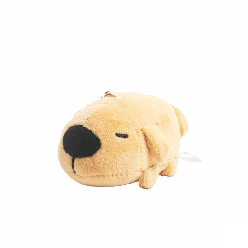 Side view of Dogdog Lazy Plush Charm, featuring a tan plush dog character lying down with eyes closed and a large black nose.