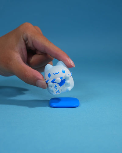 Mini Lucky Capoo Figure – Mount Fuji Blue figure shown in hand for scale