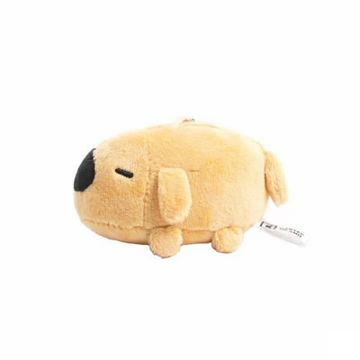 Side profile of Dogdog Lazy Plush Charm, highlighting its small ears, short legs, and tag at the back.