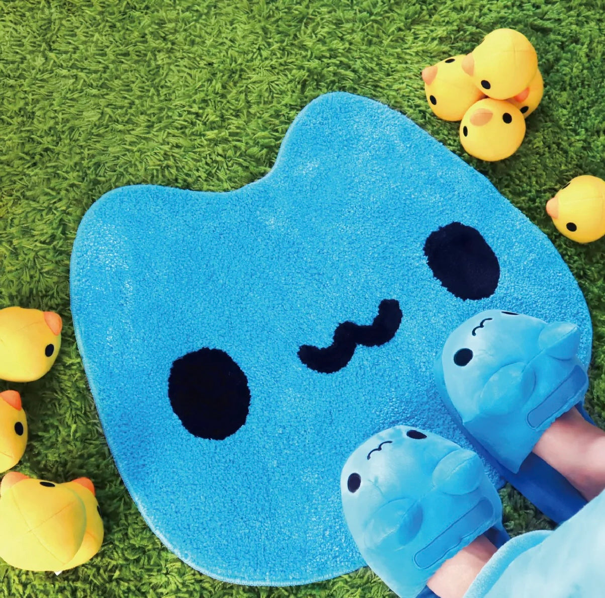 A person wearing Capoo Slippers standing on Capoo Water Absorbing Bath Mats