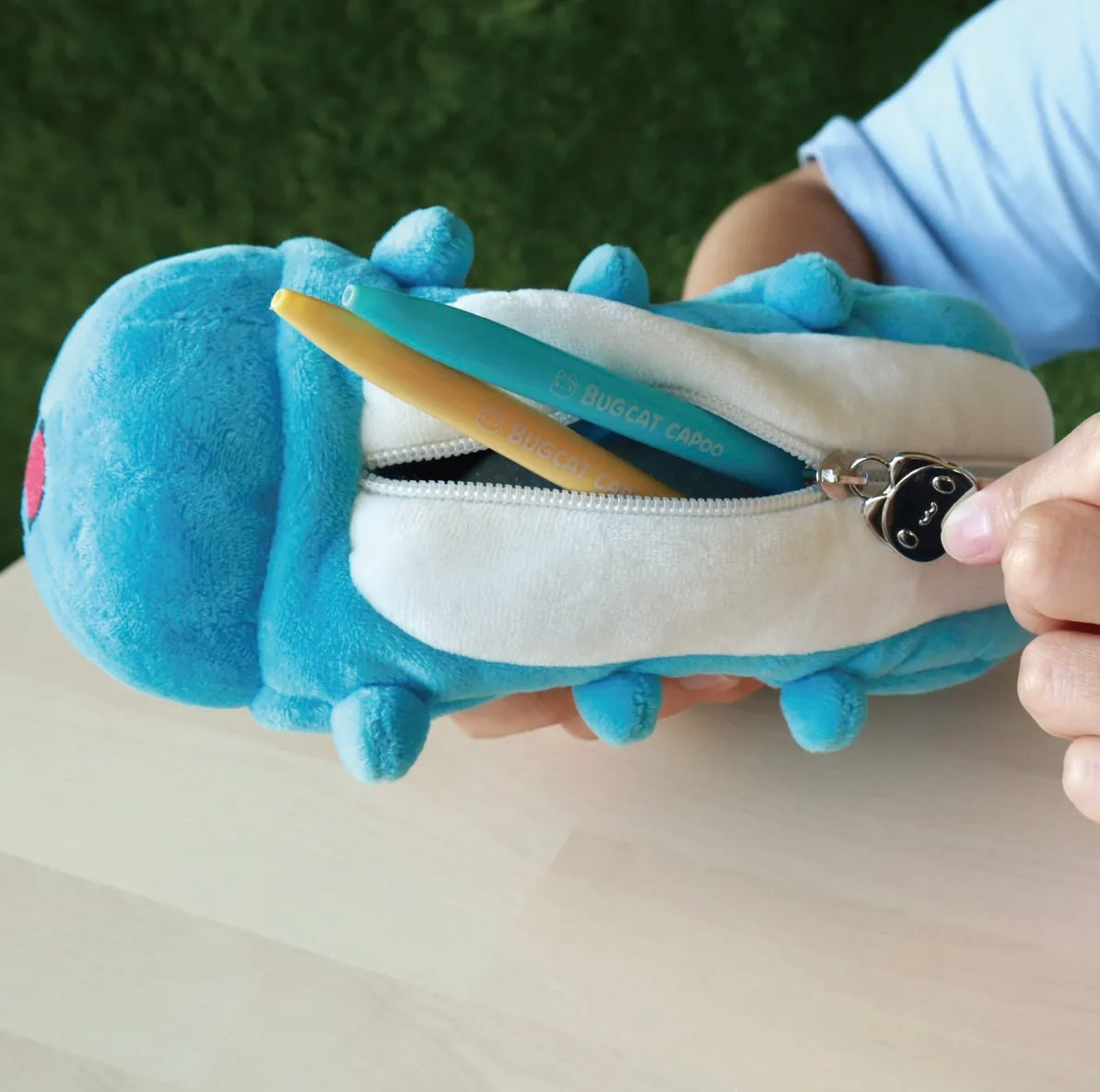 A person showcasing the Capoo Pencil Case 