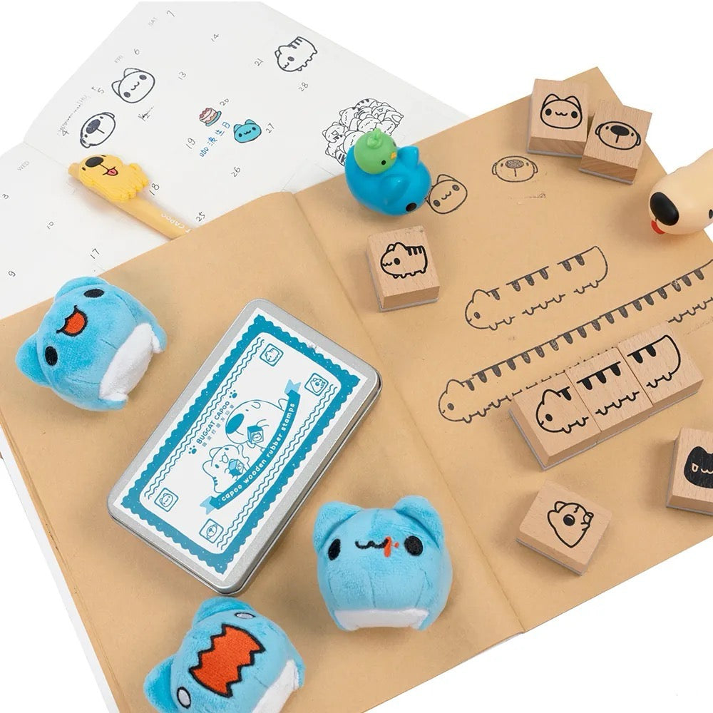 Capoo And Friends Stamp Set showcasing with plushies, pen, notebook and more